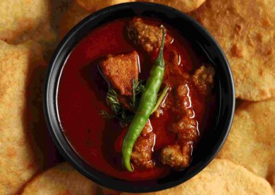 Malvani Chicken - Malvani chicken is a flavorful and spicy dish made with tender chicken cooked in a fragrant gravy made with a blend of Malvani spices, coconut, onions, garlic, ginger, and other aromatic ingredients.