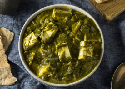 Palak Paneer - Palak paneer is a popular Indian dish where paneer is cooked in a creamy and vibrant spinach gravy, flavored with a blend of aromatic spices.